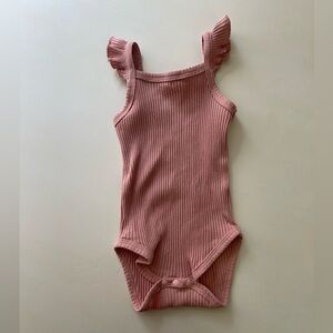 Ribbed pink baby onesie